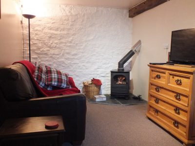 sitting room with corner log burner
